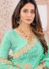 Green Blouse With Heavy Border Net Saree