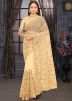 Cream Thread Embroidered Saree In Net